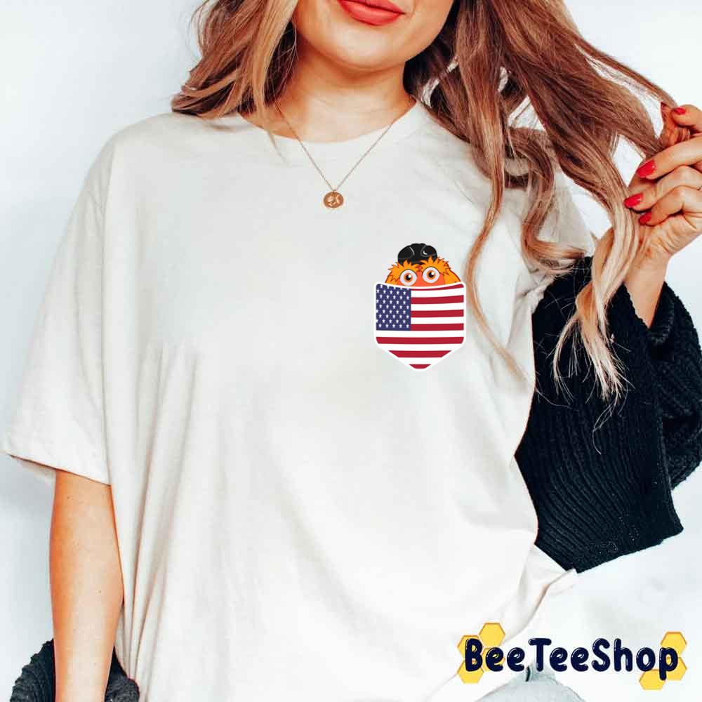Mascot Gritty In Pocket American Flag Philadelphia Flyers Hockey Unisex T-Shirt Mascot Gritty In Pocket American Flag Philadelphia Flyers Hockey Unisex T-Shirt
