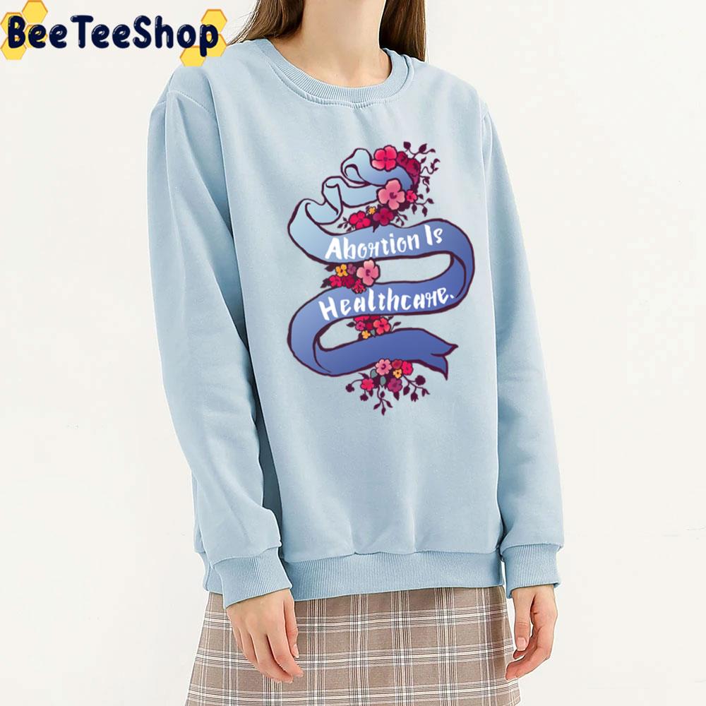 Abortion Is Healthcare Ribbon Art Unisex T-Shirt Abortion Is Healthcare Ribbon Art Unisex T-Shirt