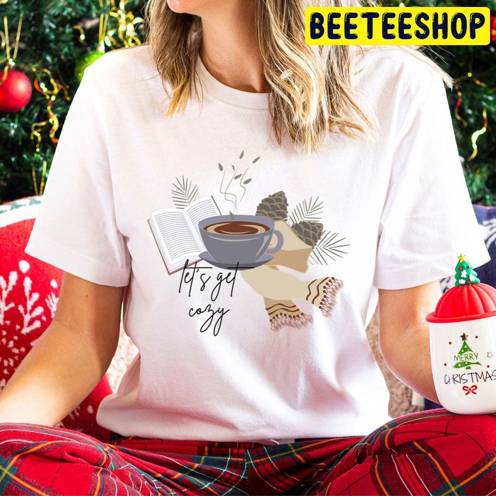 Let's Get Cozy Fall Sticker With Coffee, A Book And A Scarf With Typography Trending Unisex Hoodie Let's Get Cozy Fall Sticker With Coffee, A Book And A Scarf With Typography Trending Unisex Hoodie
