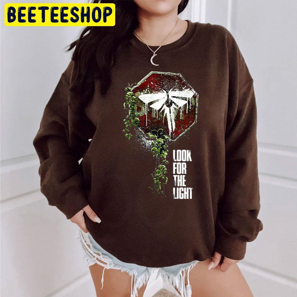 The Last Of Us Joel And Ellie Family Trending Unisex Sweatshirt The Last Of Us Joel And Ellie Family Trending Unisex Sweatshirt