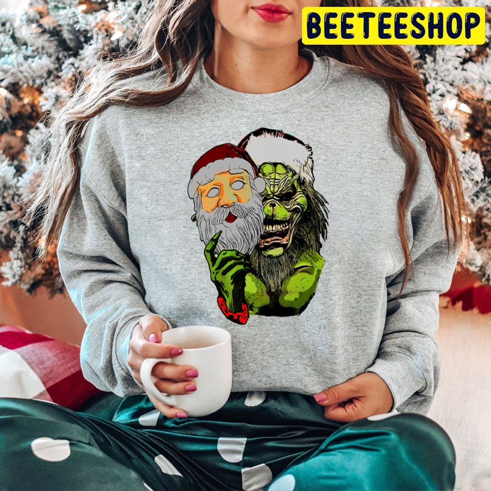 The Grinch With Santa Face Mask Christmas Trending Unisex Hoodie The Grinch With Santa Face Mask Christmas Trending Unisex Hoodie
