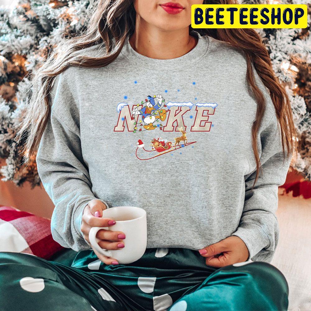 Cute Donald Nike Logo Mickey Mouse Christmas Trending Unisex Hoodie Cute Donald Nike Logo Mickey Mouse Christmas Trending Unisex Hoodie