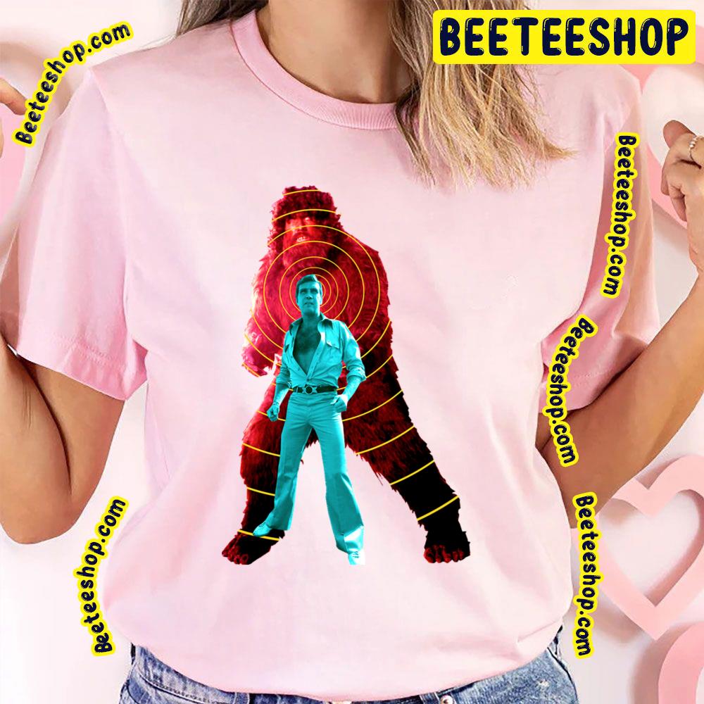 The Six Million Dollar Man Steve Austin V Bigfoot 1970s Pop Art Trending Unisex T-Shirt The Six Million Dollar Man Steve Austin V Bigfoot 1970s Pop Art Trending Unisex T-Shirt